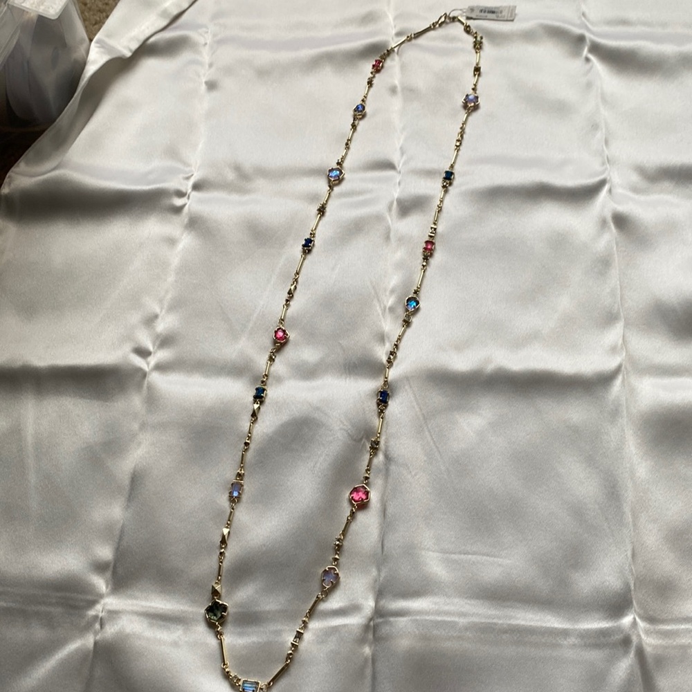 Kendra Scott long necklace with various stones.